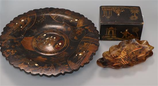 A Chinoiserie japanned papier mache caddy, a footed dish and a Japanese tortoiseshell dish largest diameter 35cm